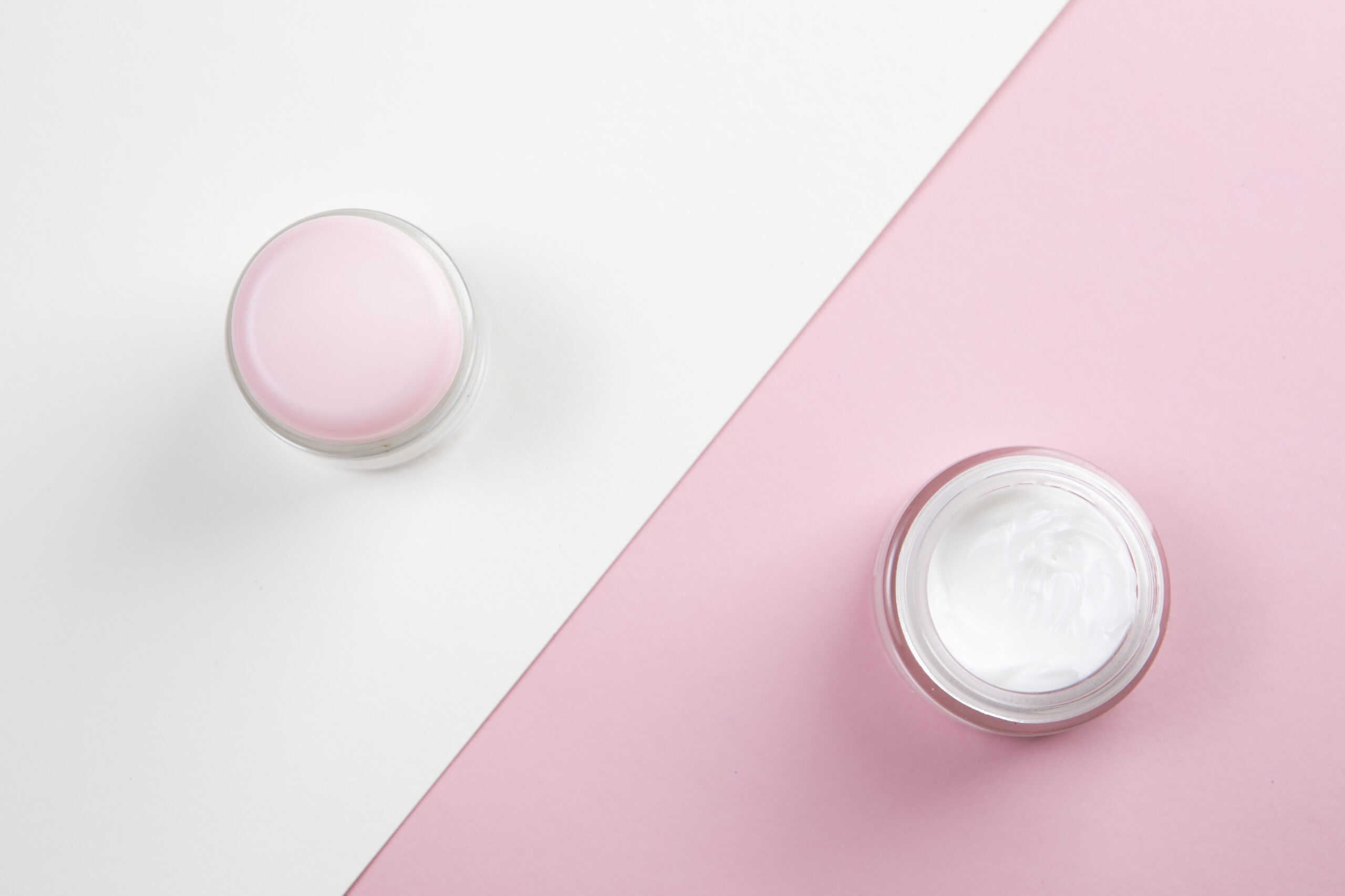 top-view-body-cream-pink-white-background
